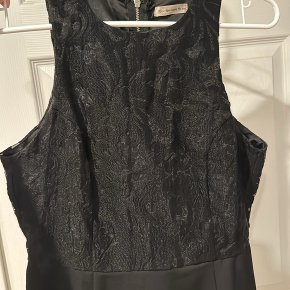 Black mini dress, slightly longer in back. Embroidery detailing on top. - Picture 3 of 3